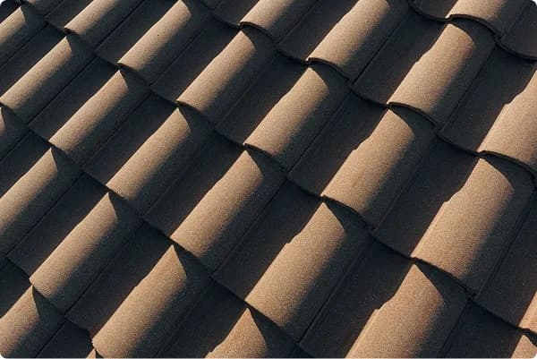 Newly installed dark shingle roof on a suburban home