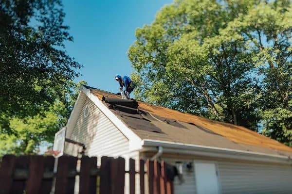 Aerial view of a finished roof over a home with a wooden deck