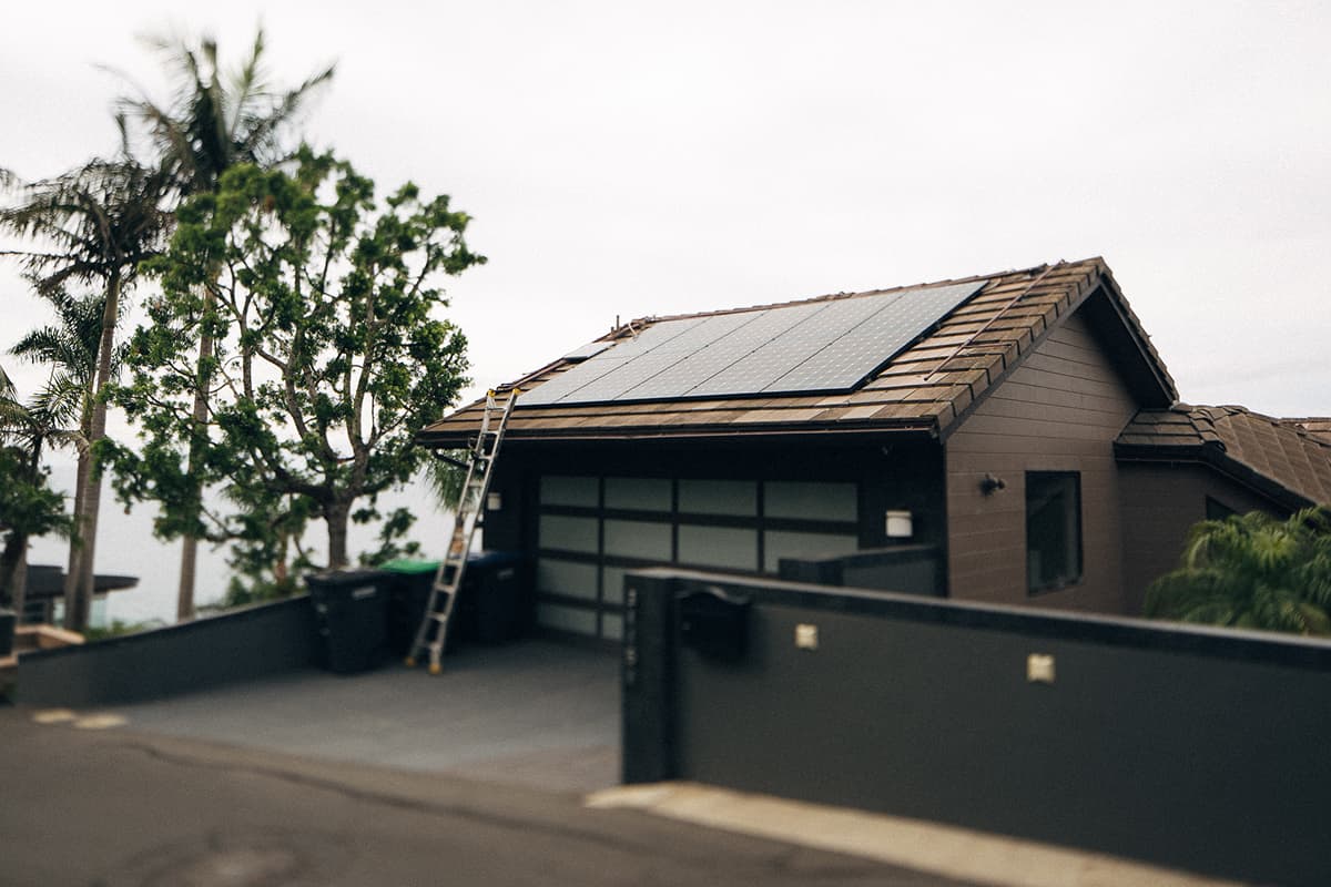 Solar panels installed on a completed residential roof